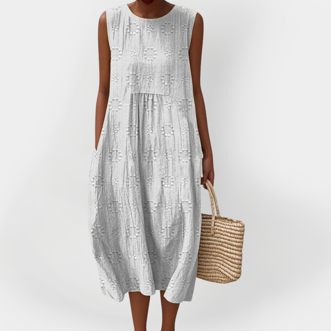 Elegantna brezrokavna bombaška obleka s prednjimi žepi